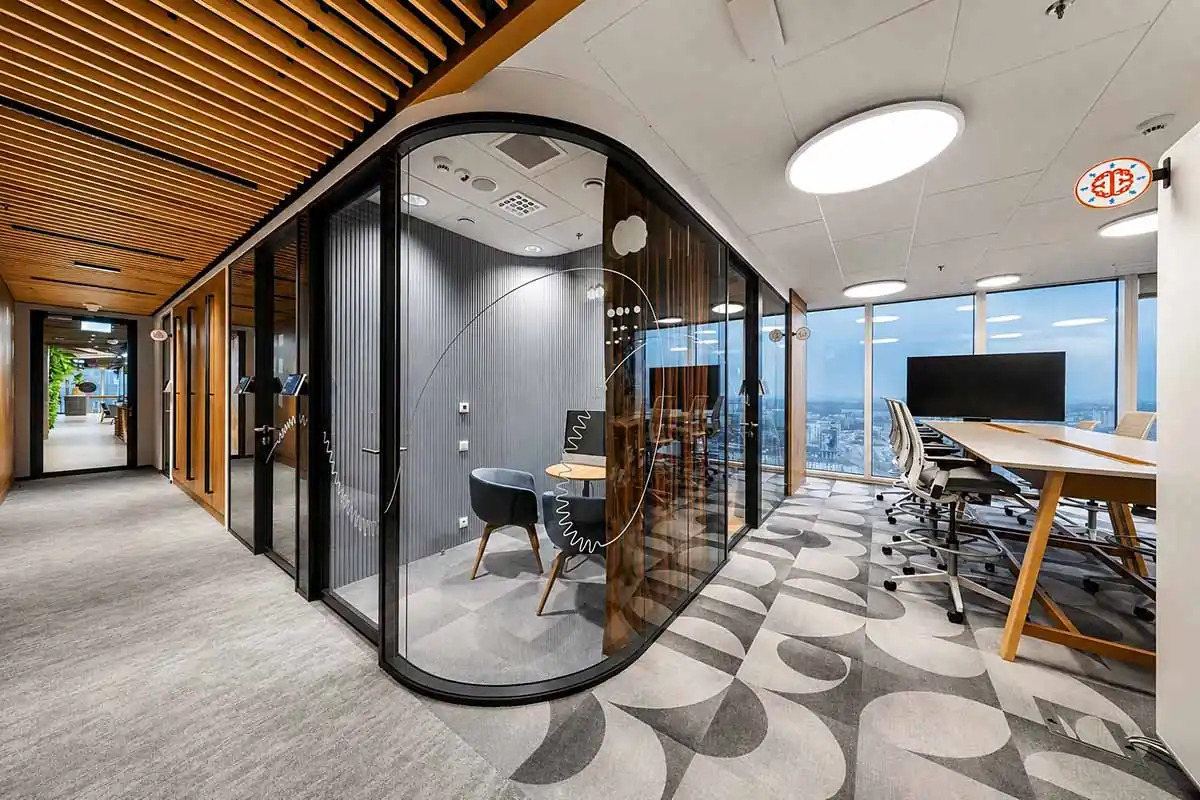 glass demountable wall system creating enclosed office and meeting spaces