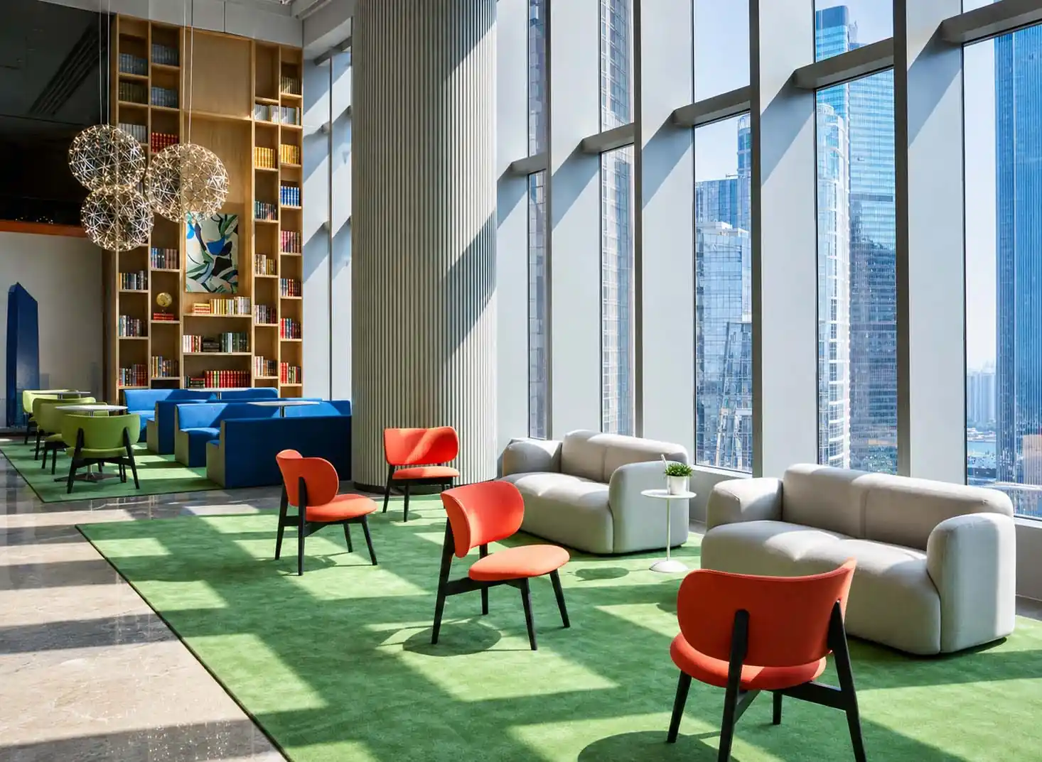 modern office lounge with sofas, lounge chairs, and collaborative seating