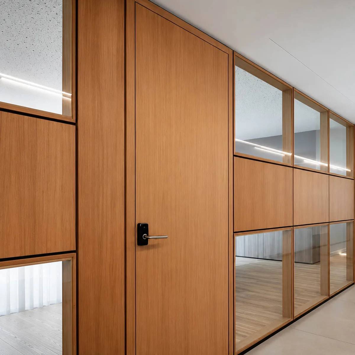 IT park office fit-out with mixed melamine board and glass partition zoning.
