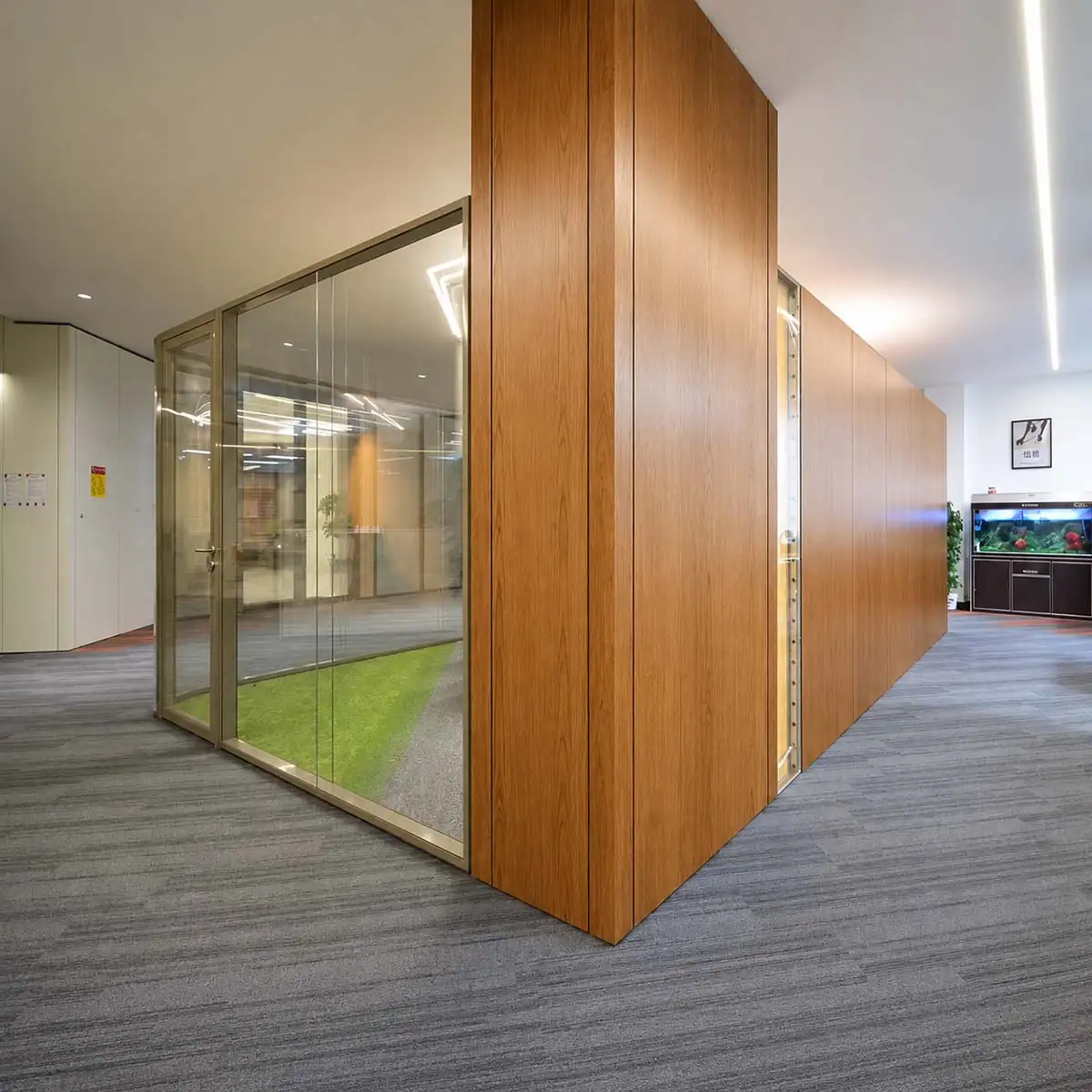 Glass and natural wood finish office partition configuration for Hong Kong education office renovation