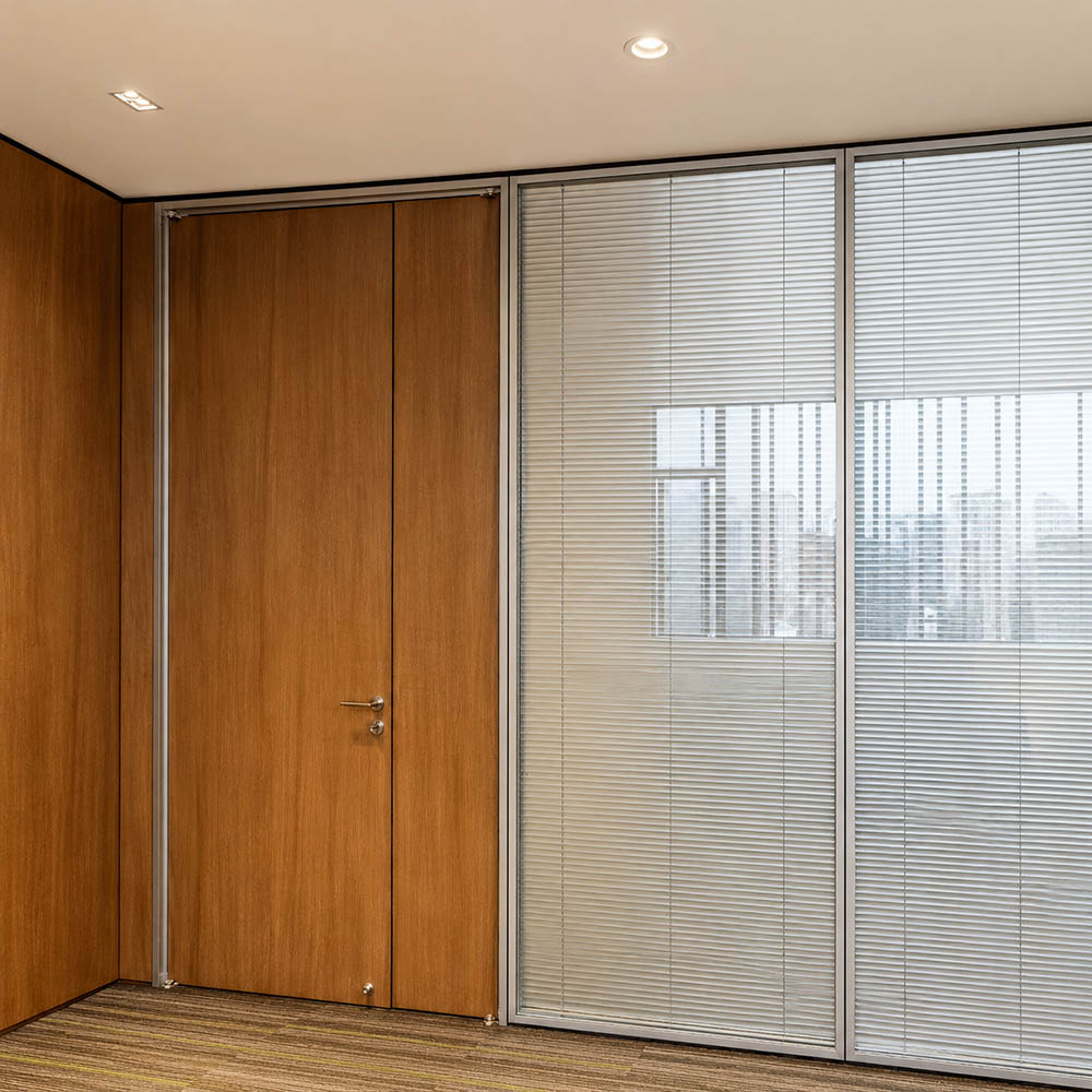 Mixed demountable wall configuration with wood door, solid panel, and glass partition with blind
