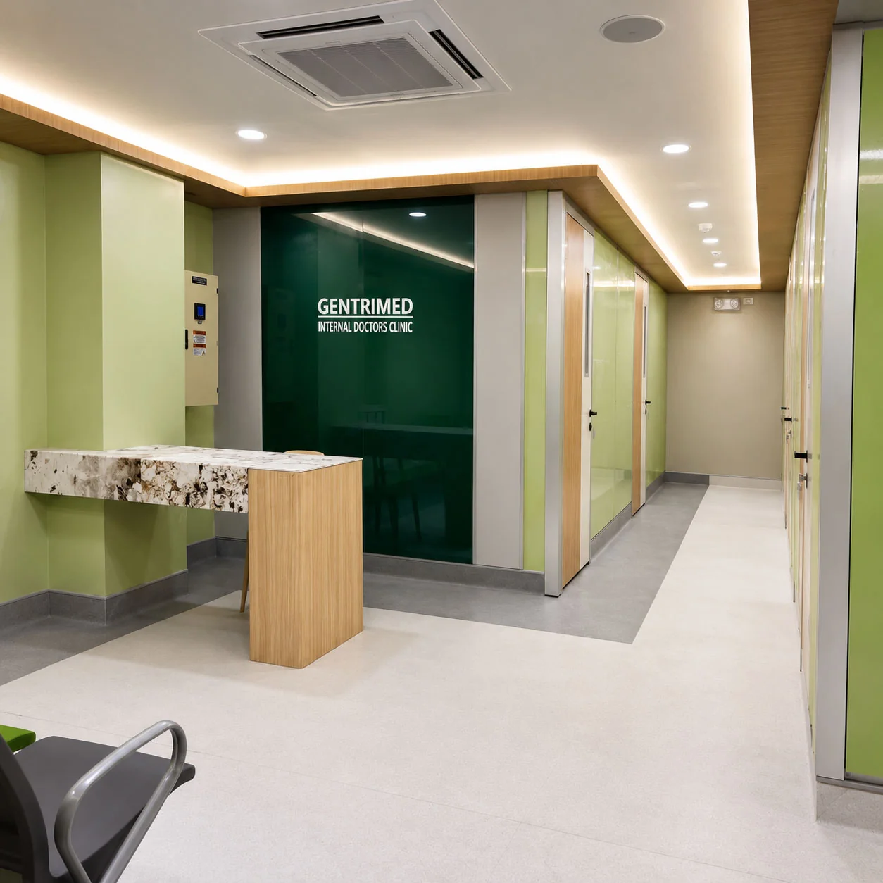 OPD renovation interior showing steel-panel walls, vision-window doors, and base skirting detail