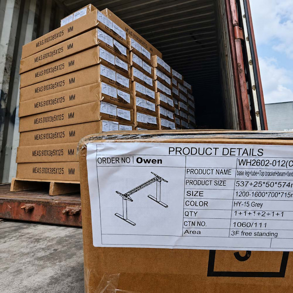 packed owen height adjustable desk frame cartons with product detail labels prepared for project shipment