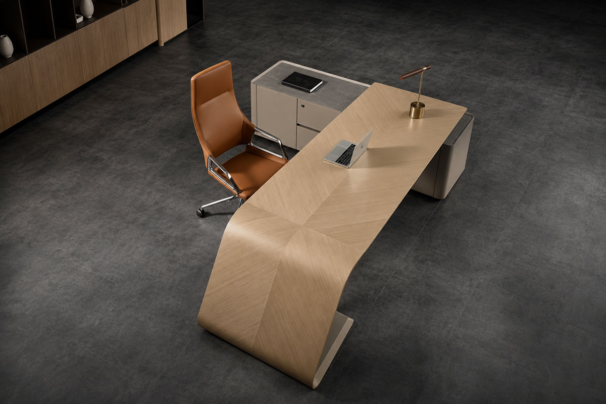 Executive office desk with wood finish, storage cabinet, and office chair