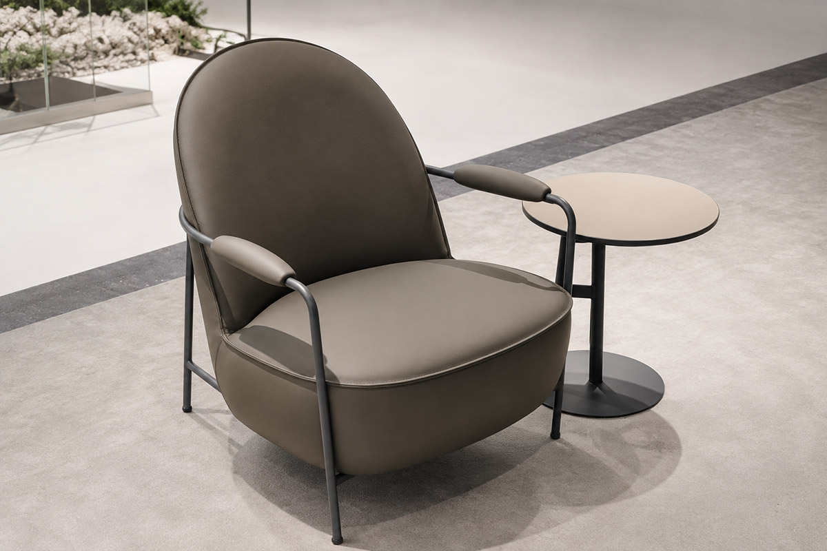 Upholstered office lounge chair with metal frame and integrated armrests