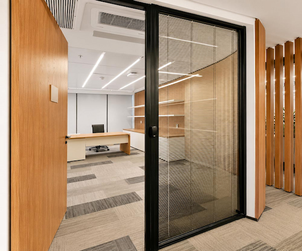 office glass partition with blinds for tested versus proposed construction review