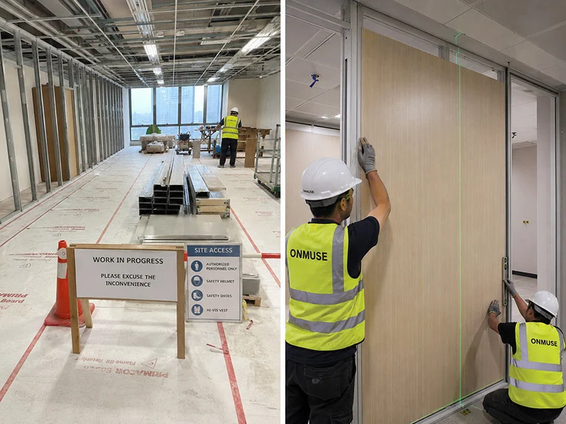 protected office renovation area and installers fitting a wood finish demountable wall panel