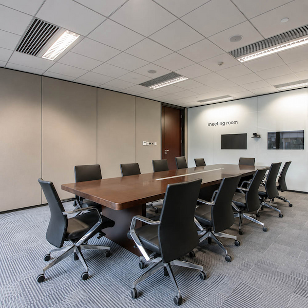 meeting room with display wall conference table ceiling services and power coordination points