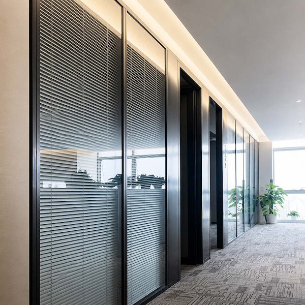 glass office partition with integrated blinds used to explain sound transmission and room reflection concerns