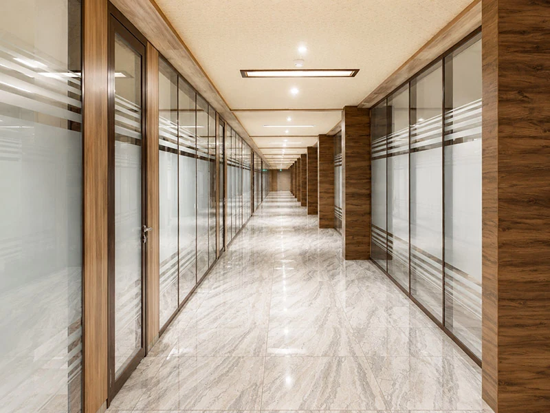 it park office fit out with glass wall partitions along a corridor