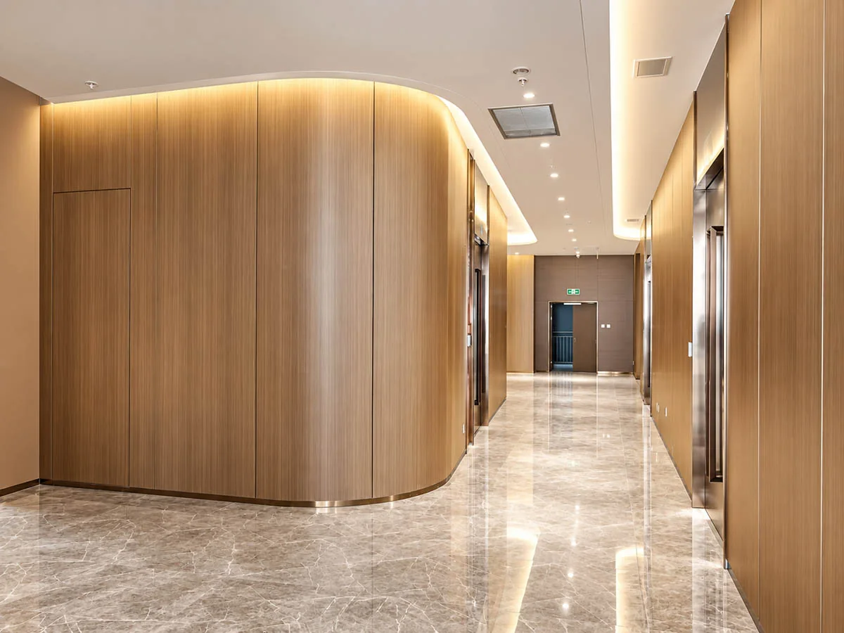 sg-100 curved panel junction with wood-finish wall application