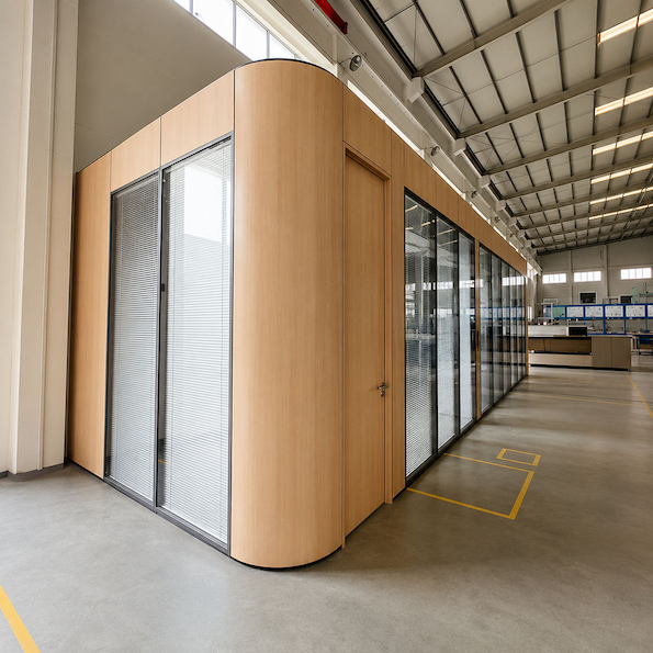 full height mixed glass and solid office enclosure with wood finish panels and internal blinds