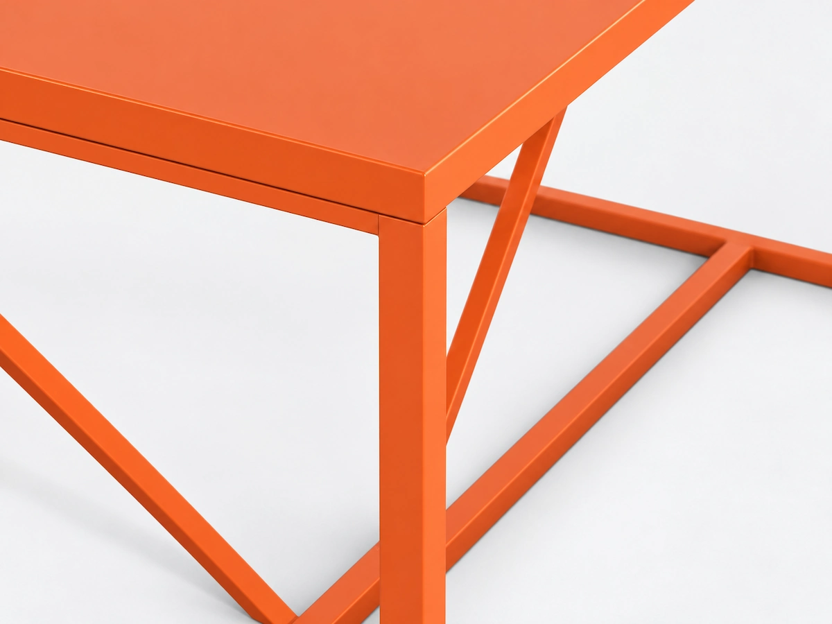 orange powder coated custom desk frame showing a project specific color finish