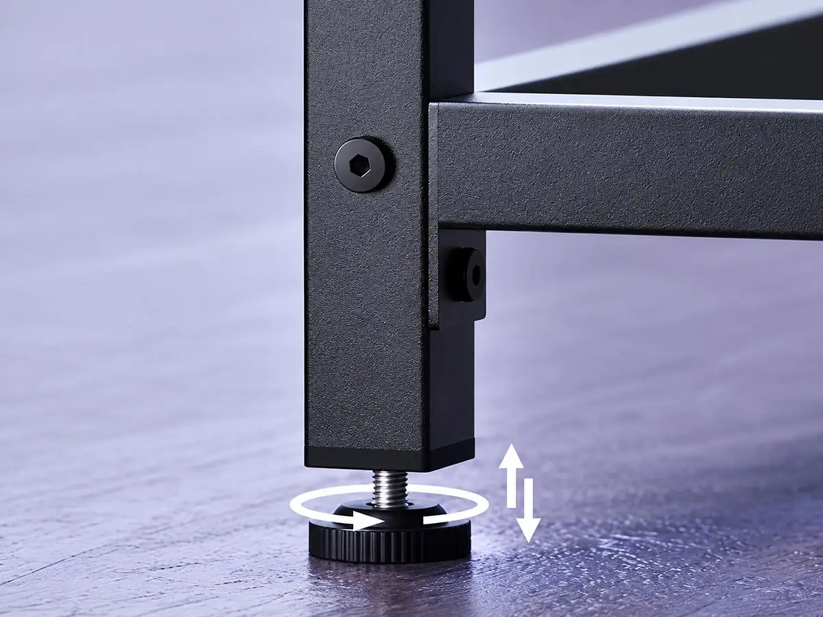 fixed-height desk frame leveling foot showing floor leveling adjustment during installation