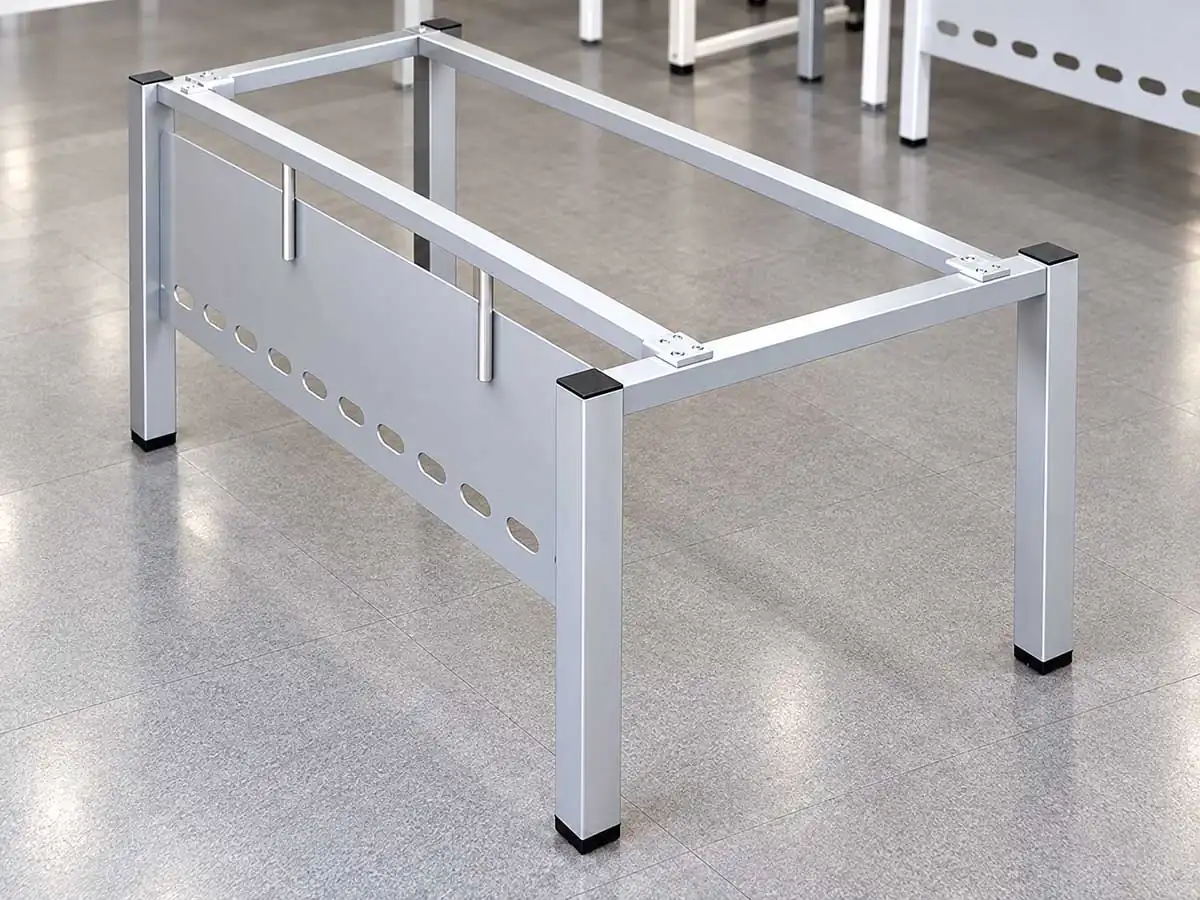 fixed-height desk frame with metal legs and a perforated modesty panel