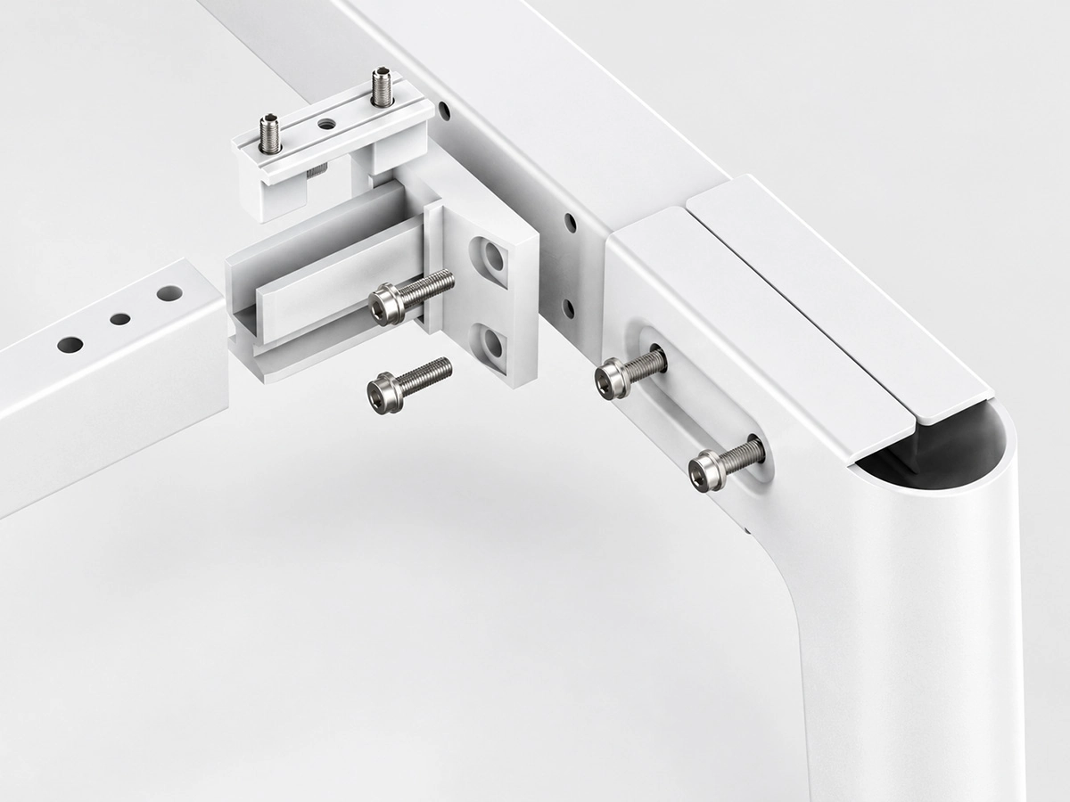 uno desk frame connection showing press formed steel leg upper beam and connector
