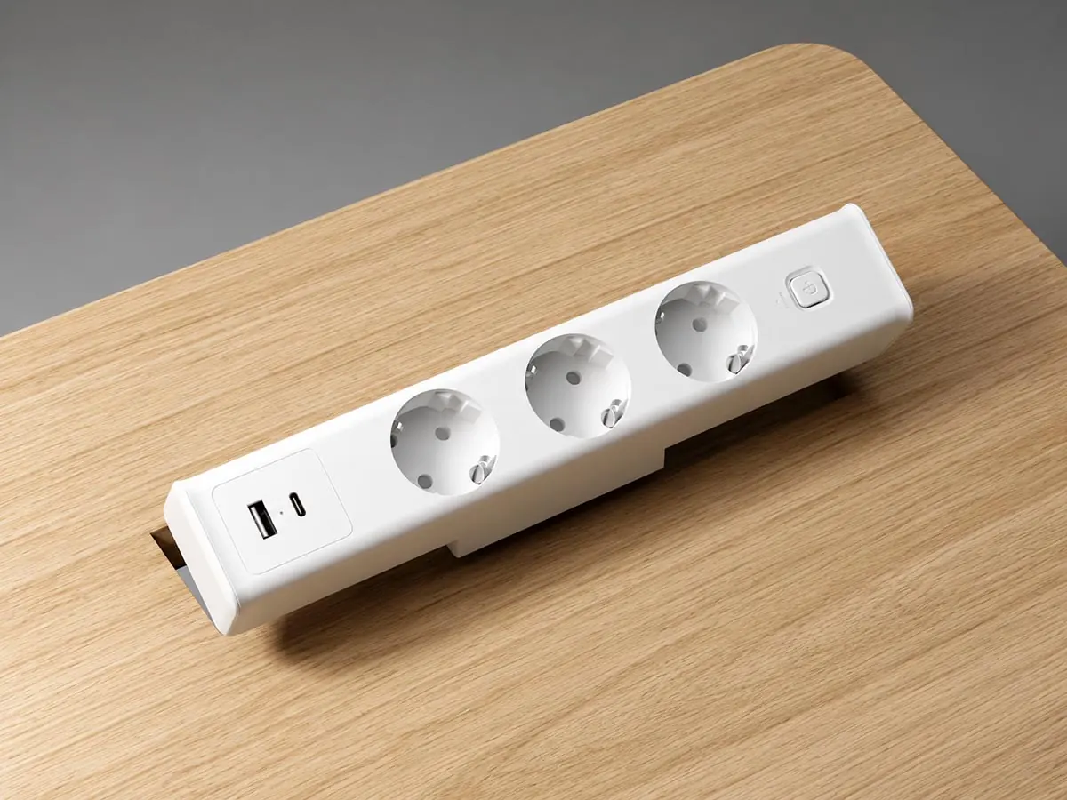 office workstation cable management power module on desktop