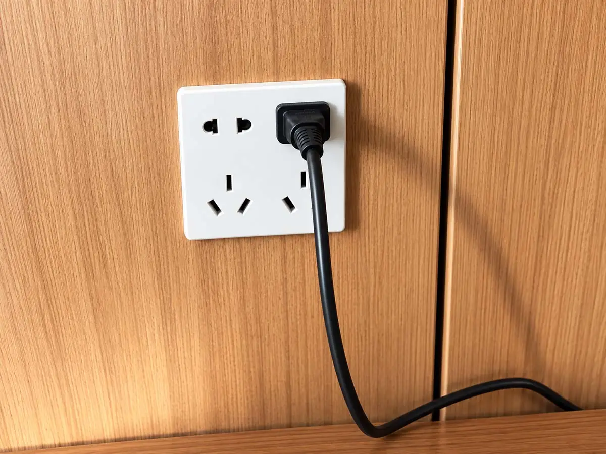 office workstation power outlet and power cable connection