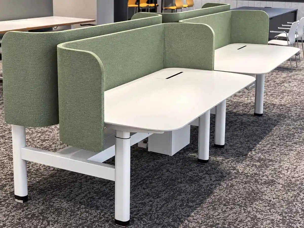 frameless fabric desk screens installed on office workstations