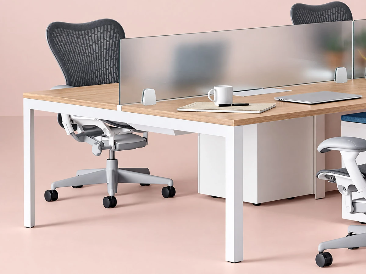 acrylic desk screen installed on office workstation