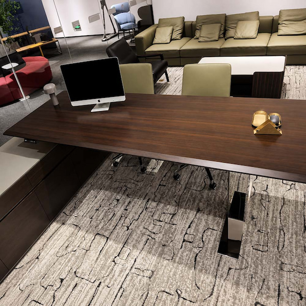 cape series height adjustable desk showroom setup with a monitor side return and surrounding furniture