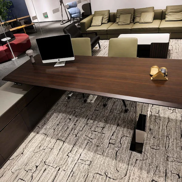 cape series height adjustable desk showroom setup with a monitor side return and surrounding furniture
