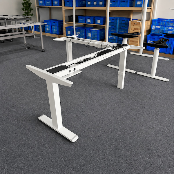 three leg l shaped height adjustable desk frame showing the main and return frame structure