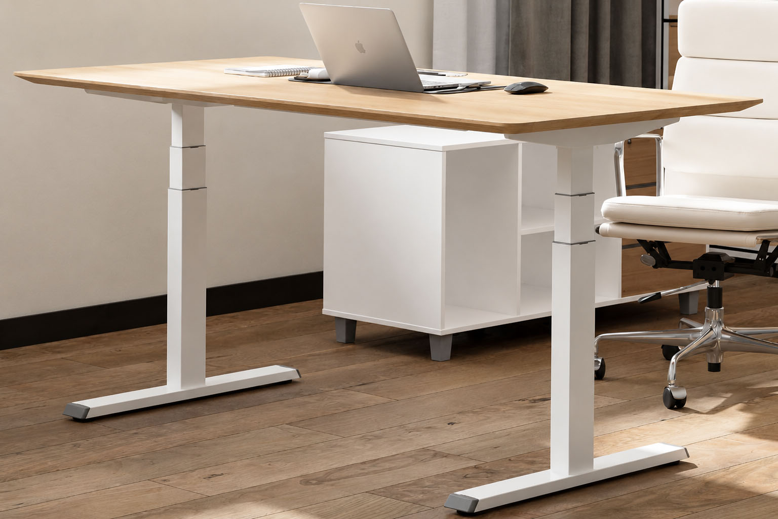 white three stage electric height adjustable desk with wood desktop in an office setting