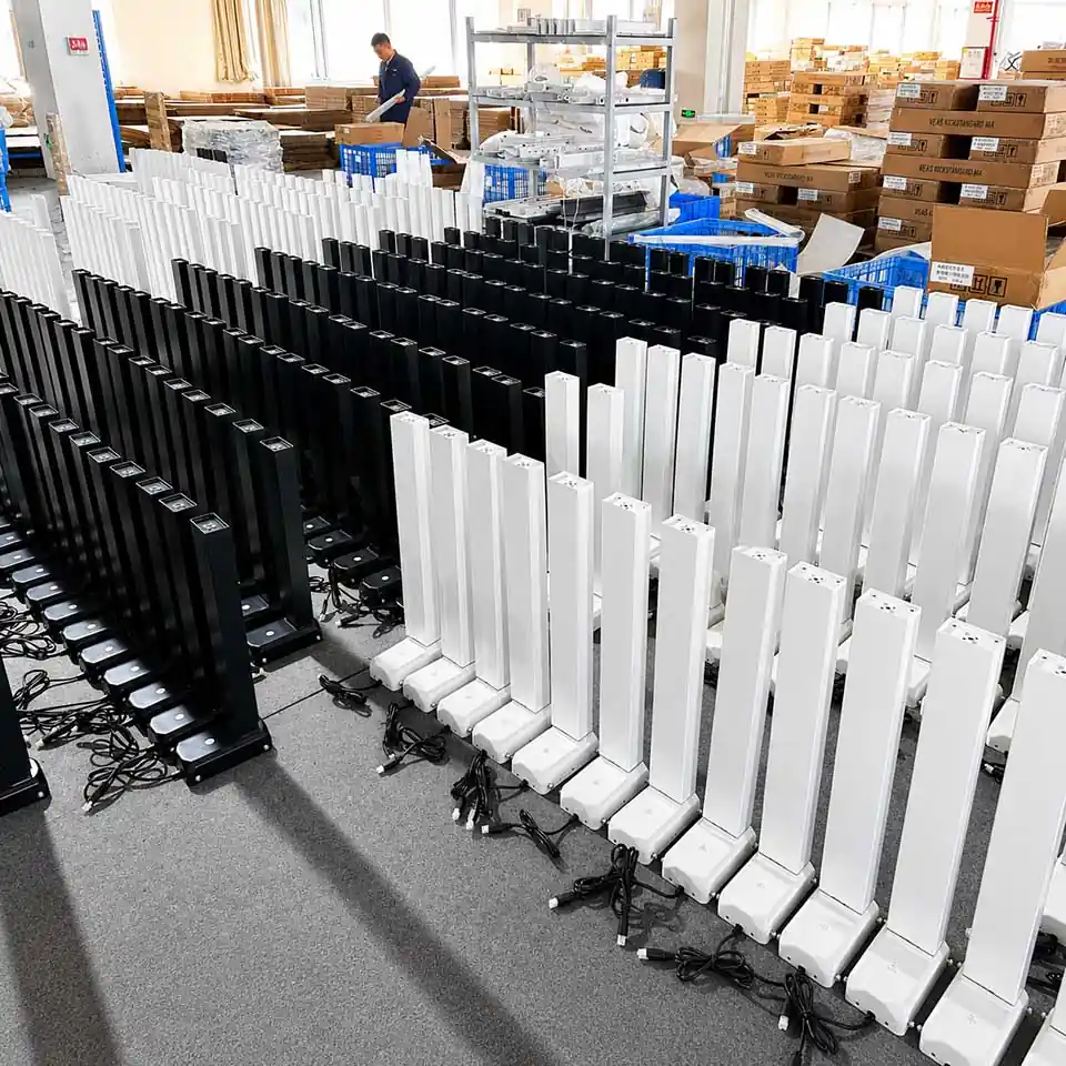 black and white standing desk lifting columns with cables prepared for configuration review