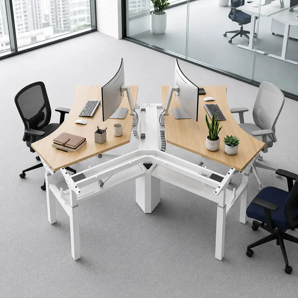 four person 120 degree height adjustable workstation with wood desktops in a modern office