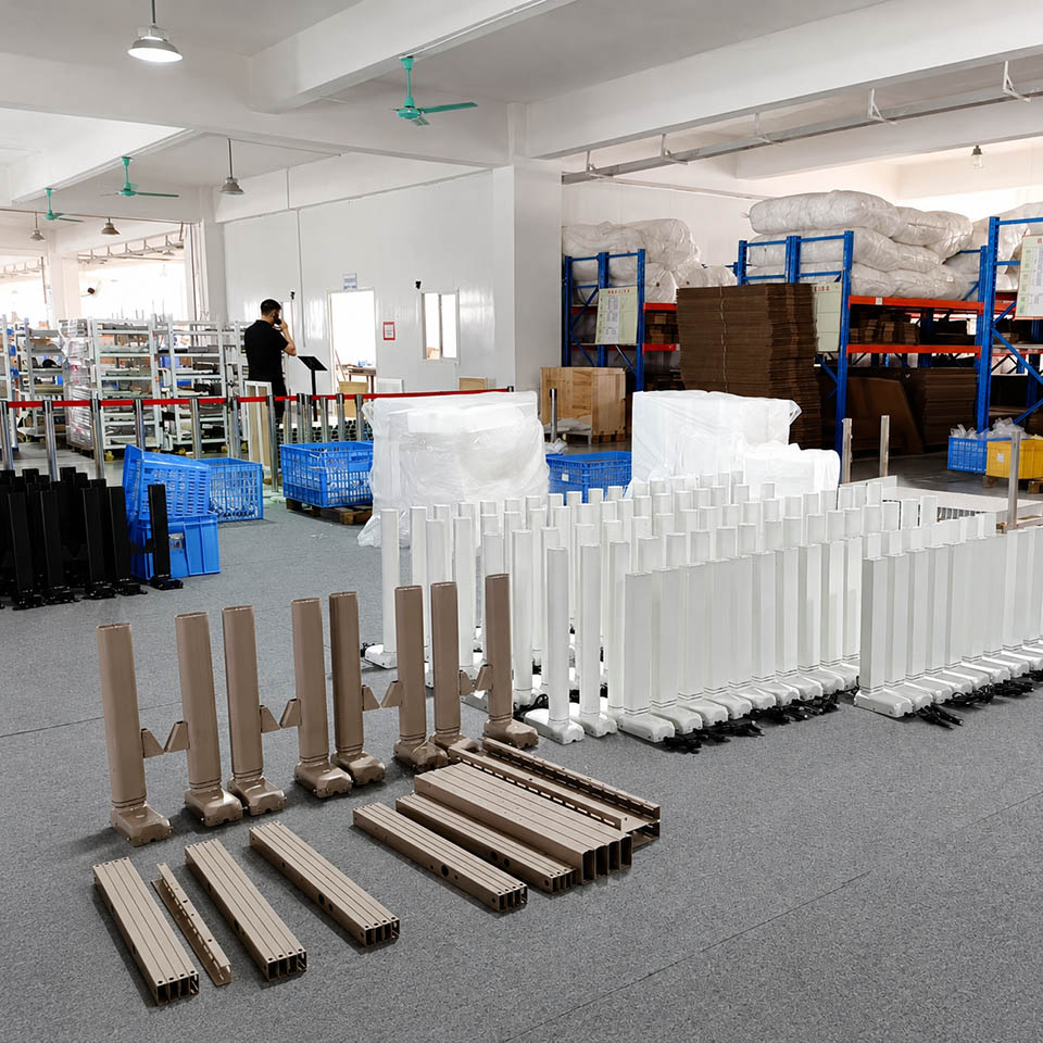 height adjustable desk columns and frame components organized by product type in the factory