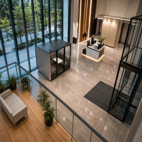 office phone booth installed in a modern office interior viewed from above